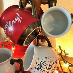 several coffee cups are stacked on top of each other with the word happy written on them