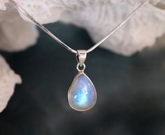 This pendant necklace is made from 925 sterling silver and natural rainbow moonstone. Very beautiful and changing color according to a source of light! It looks fabulous and timeless :) ♥ Please note as with all natural gemstones the color and inclusions may vary slightly from the pair shown. ♥ Each order will be gift wrapped beautifully ♥ QUALITY: Each item is stamped according to US regulations. ➤ Orders of $550 and more will be qualified for free UPS International Express shipping (2-3 days). Silver Necklace Designs, Silver Anniversary Gifts, Rainbow Moonstone Necklace, June Birthstone Jewelry, Silver Anniversary, Blue Moonstone, Moonstone Earrings, June Birthstone, Moonstone Necklace