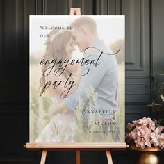 an engagement party sign with the words, welcome to our guests