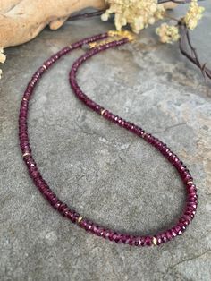 Gorgeous gemstone beaded necklace .. crafted with the most stunning faceted Rhodonite Garnet gemstones . This beauty measures 16 inches in length with a gold tone extender chain and tiny rutilated Quartz charm . Gold Rondelle Crystal Necklace With Gemstone, Garnet Pendant, Gemstone Beaded Necklace, Gemstone Beaded Bracelets, Beaded Hoop Earrings, Beaded Hoops, Garnet Gemstone, Rutilated Quartz, Statement Earrings