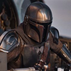 the star wars character is dressed in armor