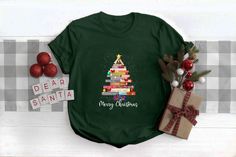 Merry Christmas Books Shirt, Christmas Books Tee, Christmas Teacher Gift, Christmas Bookworm Shirt, Bookish Shirt, Bookish Christmas Gifts How to Order T-shirt  1-        Please, check and review all photos 2-        Please choose your t-shirt style and size 3-        Please choose your t-shirt color 4-        Click add to cart. 5-        Please click the ""Proceed to Check Out"" button. Important Notice 1- We have multi brand shirts. Your order may contain different brand of t-shirts. If you want specific brand please let us know at the order stage. 2- Measurements shown on the chart may vary by +/- 10%. Product and Washing  We are doing DTF. Shirts Solid Colors are %100 cotton. Heathers are %52 cotton %48 polyester. Sweatshirts %50 cotton %50 polyester. Wash the  inside of the T-shirt in Christmas Bookstore, Merry Bookmas, Personalized Gifts Christmas, Bookish Christmas, Bookish Style, Christmas Wardrobe, Bookworm Shirt, Book Tree, Librarian Shirt