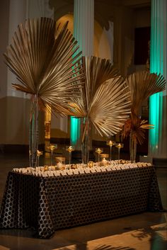 the table is set up with candles and centerpieces