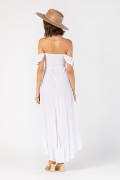 Born in the Borough that embodies the rhythm and soul of New York city, the Brooklyn Dress’ edge and grace has become a Tiare Hawaii staple. Perfect for beach getaways to nights out on the town, we love its effortless versatility and elegance. You’ll adore flowing with each step and accessorizing to your mood. Details: 100% Rayon Hand Wash & Lay flat to dry Features: Off the shoulder ruffle sleeve, Elasticized neckline and waist, High-low ruffled hem Measures: Approximately 31" for the shortest Flowy Breezy Rayon Maxi Dress, White Flowy Rayon Maxi Dress, White Rayon Maxi Dress For Beach, Flowy Breezy Rayon Midi Dress, Breezy Flowy Skirt Maxi Dress For Day Out, Flowy Rayon Maxi Dress For Summer, Chic Summer Midi Dress For Beach Wedding, Beach Sundress With Flowy Skirt, Summer Flowy Midi Dress For Beach