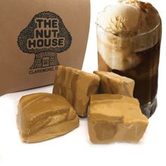 some ice cream and brownies are next to a bag with the nut house logo on it