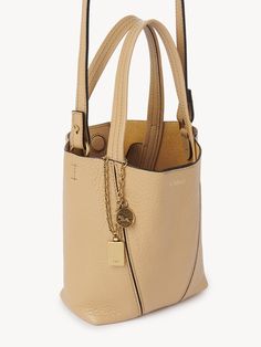 Chloé Small Chloé Spin Tote Bag In Grained Leather | Chloé US Hand Wrist, Popular Bags, Coffee Milk, Orange Bag, Chloe Bag, Colored Leather, Chic Accessories, Metal Ring, Understated Elegance