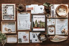 a table topped with lots of different types of cards and magnets on top of wooden boards