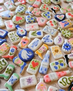 many different colored and shaped cookies on a table