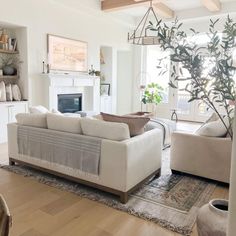 a living room filled with furniture and a fire place