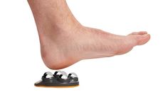 a person standing on top of a pair of shoes with their feet in the air