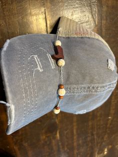 Fancy up your trucker hat with this super cute cowboy boot hat chain.  The white and turquoise beads are super versatile so you can display it on various hats  These chains clip onto the mesh of your hat and lay across the bill to add a little extra sass to your hat.  Trucker hat bands are approx. 9" long.  They are all handmade and can be customized just for you. Turquoise Hat, Hat Chain, Hat Bands, Cowboy Boot, Hat Band, Turquoise Beads, Trucker Cap, Cowboy Boots, Caps Hats