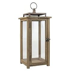 an old fashioned wooden lantern with glass doors