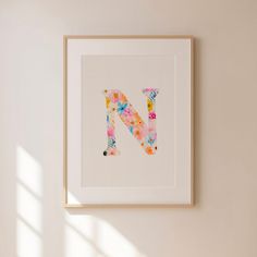 the letter n is made up of colorful flowers