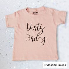 Dirty 3rd-Y great shirt for your little ones 3rd Birthday! Quality & Sizing: We only use the best and most durable vinyl, Thermoflex vinyl Soft and comfortable fabric. 100% cotton. Available T-shirt Colors: Light Pink, White, Black, Light Pink, Hot Pink, Blue, Yellow, Gray, Navy. Available Vinyl Colors: Black, White, Hot Pink. Available T-Shirt Sizes: 24 mo./2T/3T/4T/{Rabbit Skins} Youth XS(2/5) {Gildan} *PLEASE GO UP A SIZE IF YOU ARE IN BETWEEN SIZES. THESE SHIRTS RUN SLIGHTLY SMALL!* Order Pr First Birthday Name Print Top, Pink Crew Neck Shirt For First Birthday, Pink Top With Funny Print For First Birthday, Pink Shirt With Funny Print For Birthday, Cute Pink Shirt For Party, Pink T-shirt With Funny Print For First Birthday, Birthday Toddler Girl, Girls Valentine Shirt, Kids Valentines Shirts