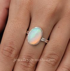 Ethiopian Opal Ring, 925 Sterling Silver Ring, Oval Shaped Ring, Handmade Silver Jewelry, Welo Fire Ring, Ring For Women, Birthday Gift. Gemstone Name - Ethiopian Opal  Stone Quality - AAA  Ring L - 1.6 CM RING W- 1.1CM Weight - 3.88 gm Stone Shape- As shown in the picture We serve complete 925 sterling silver Jewelry and genuine properties of the stone.  The products are dispatched from the small business from UK. Product Quality and Packaging - Our all products are 925 Silver Stamped which shows that the product is genuine and authentic .The products are dispatched from the small business from UK so you get the product on time and the product packaging comes in bubble foil wrap with all the precautions taken primarily that your product reaches you with zero damage. Healing Properties of Fire Ring, Ethiopian Opal Ring, Silver Jewelry Handmade, Opal Gemstone, 925 Sterling Silver Jewelry, Opal Rings, Ethiopian Opal, 925 Sterling Silver Ring, Rings Statement