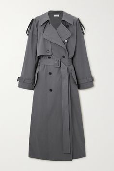 The Row has an incredible eye when it comes to refining and refreshing classics. This double-breasted 'Avio' trench coat is made from washed cotton-poplin and has traditional details, including shoulder epaulets, storm flaps and buckle-fastening cuff tabs. The silk lining ensures smooth layering and the belt cinches the waist. Luxury Wool Long Sport Coat, No Sleeve Coats, Luxury White Sporty Outerwear, Classic Luxury Wool Utility Jacket, Luxury Classic Wool Utility Jacket, Elegant Luxury Ralph Lauren Outerwear, Luxury Cotton Winter Sport Coat, Luxury Beige Winter Windbreaker, Luxury Oversized Single Breasted Wool Coat