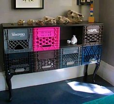 a shelf with several crates on top of it in front of a wall mounted animal skull