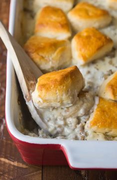 a casserole dish filled with biscuits and cheese