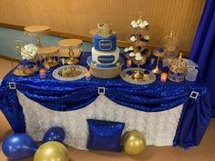 a table with blue and gold decorations on it