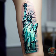 the statue of liberty tattoo is shown on someone's leg and it looks like they are