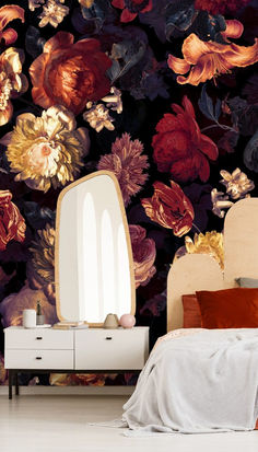 a bedroom scene with focus on the bed and flower wallpaper that's covering the walls