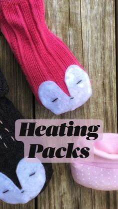 three pairs of socks that have been made to look like animals with the words heating packs on them