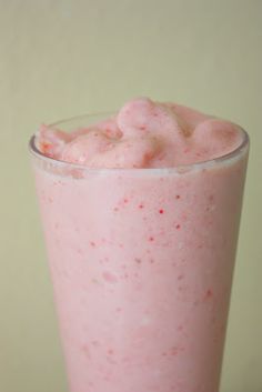 a pink drink with whipped cream on top