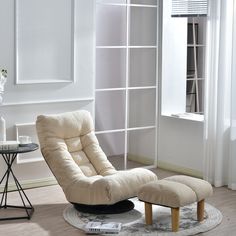 a chair and ottoman in a living room