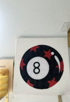 the eight ball sign is hanging on the wall