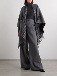 Valentino Garavani's poncho is a chic way to stay warm in transitional weather. Made from sumptuous wool, silk and cashmere-blend, it's jacquard-knitted with the 'VLOGO' at the reverse and has an enveloping design traced with swishy fringing. The deep charcoal shade is endlessly versatile. Cashmere Poncho, Fringed Poncho, Dress Flats, Exclusive Dress, Sport Swimwear, Sports Skirts, Shearling Jacket, The Deep, Jeans Dress