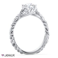 a white gold engagement ring with an intricate vine design on the band and center stone