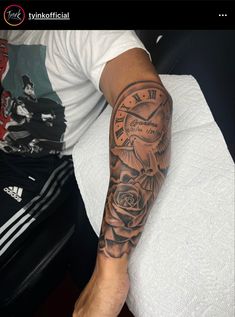 a man's arm with a clock and roses tattoo on the left side of his arm