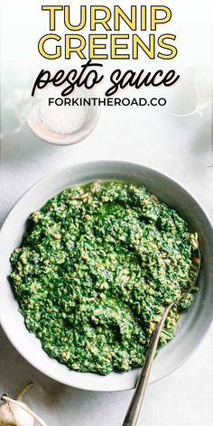 a white bowl filled with pesto sauce