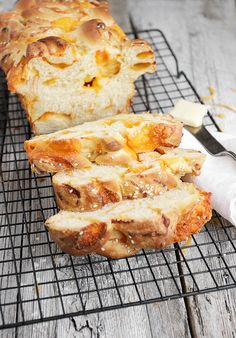 a loaf of bread sitting on top of a metal rack