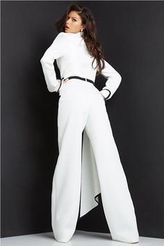 Jovani 06917 Notched Collar Long Sleeve Plunging Neck Jumpsuit. The Jovani 06917 is a one-piece jumpsuit designed to make an impression. This timeless piece features a notched collar, long sleeves, and a deep plunging neckline perfect for a night out. Keep warm and look stylish with Jovani's classic piece. Sizes; 00,0,2,4,6,8,10,12,14,16,18,20,22,24 Colors: Black/White, White/Black Off Shoulder Cocktail Dress, Short Sheath Dress, Mnm Couture, Bold Dresses, Long Sleeve Sheath Dress, Formal Jumpsuit, Long Sleeve Fitted Dress, Stylish Jumpsuit, Jumpsuit Chic