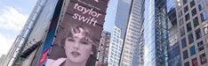 an advertisement for taylor swift on the side of a building in new york city, ny