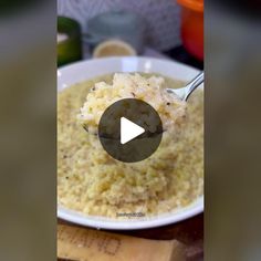 a white bowl filled with rice on top of a table