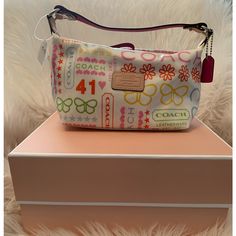 Adorable & Sweet! Coach Signature Bandana Pouch. Fs8815. Coach Factory. White Laminated Leather Satchel Multi Color. New With Tag! Great Condition! Perfect For A My First Coach! :) *Few Small Marks On Bottom Of Purse From Storing. See Photo - Non-Smoker Home. White Shoulder Bag With Zipper Pouch For Gift, White Shoulder Bag With Zipper Pouch As Gift, Coach White Pouch Shoulder Bag, White Coach Pouch Bag, White Coach Pouch Shoulder Bag, Coach Satchel Shoulder Bag Gift, White Coach Bucket Bag, Multicolor Coach Bags As Gifts, Coach Bags With Removable Pouch As Gift