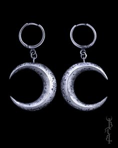 In honour of Artemis, goddess of the wilds and goddess of the moon. She who wears the crescent moon crown. These earrings feature a pair of faceted crescent moons, uniquely textured with lunar craters and crosshatched markings giving it the appearance of an ancient relic. The earrings are produced entirely in sterling silver which is treated with a dark patina then brightly polished to highlight the depth of all the intricate details. Each set of moons come on a pair of our favourite 'huggie' ea Festival Crescent Jewelry With Sun And Moon Design, Crescent Sun And Moon Festival Jewelry, Bohemian Crescent Moon Phase Jewelry, Festival Crescent Sun And Moon Jewelry, Mystical Crescent Brass Earrings, Crescent Metal Jewelry For Festivals, Metal Crescent Jewelry For Festivals, Crescent-shaped Metal Jewelry For Festivals, Metal Crescent Shaped Festival Jewelry