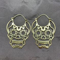 Day of the Dead Sugar Skull Hoop EarringsThese are so fun to wear, lightweight and sturdy.-Plain Brass with 20 gauge half-hard Brass Wire OR-Solid 925 Sterling Silver with 20 gauge half-hard Sterling Silver wire 1 5/8" width and 2 1/8" hanging length. Gold Skull Earrings Nickel Free, Grass Valley, Nov 1, Day Of The Dead, Silver Wire, The Dead, Sugar Skull, Solid 925 Sterling Silver, Alex And Ani Charm Bracelet