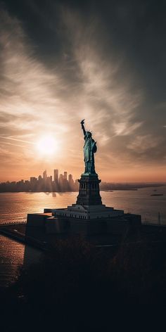 the statue of liberty is silhouetted against an orange and black sky at sunset in new york city