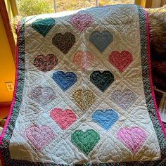 there is a quilt that has hearts on it