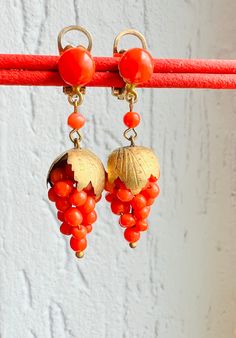 Genuine Undyed Red Coral clip on earrings set in Gold plated Sterling Silver Vintage Mediterranean Precious Red Coral earrings Coral Bunch of Grape earrings. Earrings size 4 by 1.2 cm. Weight 6.4g. The decoration dates from the middle of the last century and is in excellent condition. SHIPPING *This product will be sent to you in a gift package. *Our store provides free shipping to any country in the world. Delivery will be done with tracking. Red Drop Clip-on Earrings As Gift, Red Drop Clip-on Earrings For Gift, Red Dangle Clip-on Earring, Red Dangle Single Clip-on Earring, Orange Clip-on Jewelry For Gift, Red Clip-on Round Jewelry, Red Round Clip-on Jewelry, Adjustable Dangle Clip-on Earrings For Gift, Adjustable Dangle Clip-on Earrings As A Gift