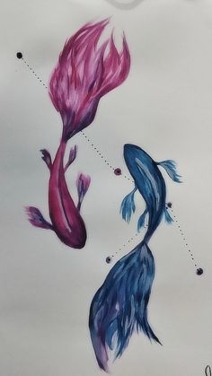 two fish are swimming in the water with their tails touching each other's heads