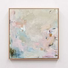 an abstract painting hanging on the wall