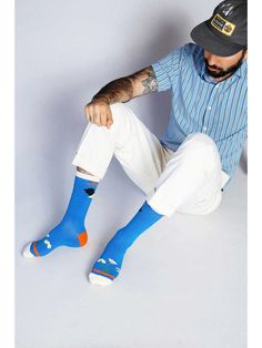 A part of Tailored Union's artist collaboration with Robbie Simon. A trademark of Robbie's style consists of abstract shapes and bright colors. With the tailored union signature lightweight feel, combined cotton blend, and arch support these socks are equally stylish and practical. Size: + OSFA, M 9-12 Design: Reinforced toe & heel + Seamless toe + Classic Ribbed Tube Sock + Crew Content + Care + Premium Cotton + Wash Cold/Dry Low + Imported Designed by Robbie Simon for Tailored Union. Trendy Blue Socks For Summer, Trendy Blue Summer Socks, Blue Cotton Socks For Summer, Playful Blue Cotton Socks, Flower Crew, Artist Collaboration, Mens Crew Socks, Blue Socks, Crew Sock