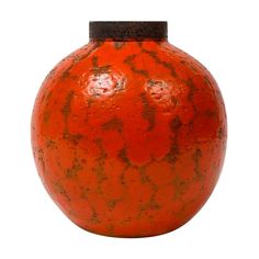 an orange vase is shown on a white background with black trim around the top and bottom