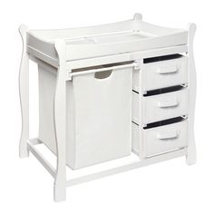 a white baby changing table with three drawers