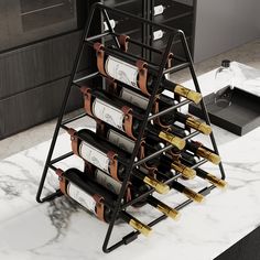 a wine rack that has several bottles on top of it and is sitting on a marble countertop