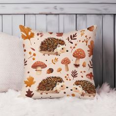 a pillow with hedges and leaves on it